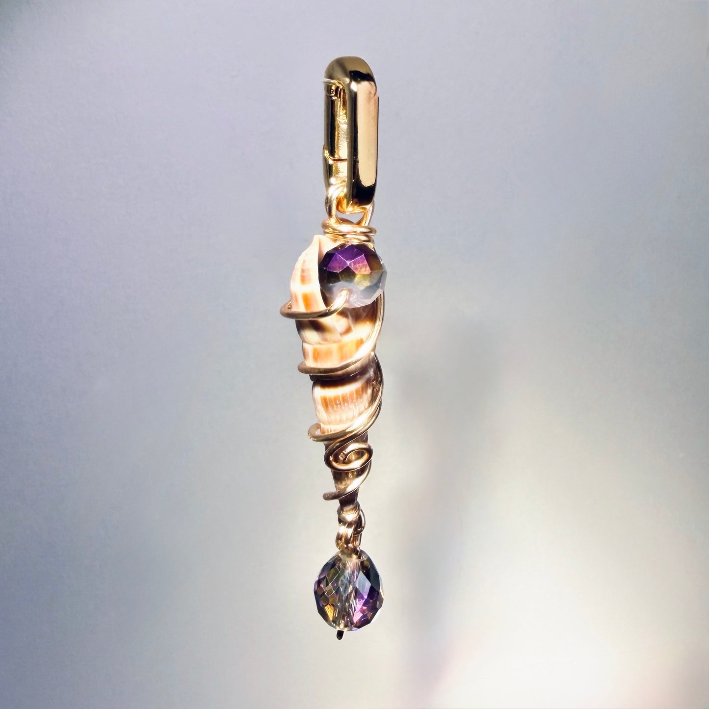 The Sea Spire Charm — Spiral Shell w/ Violet Swarovski Drop