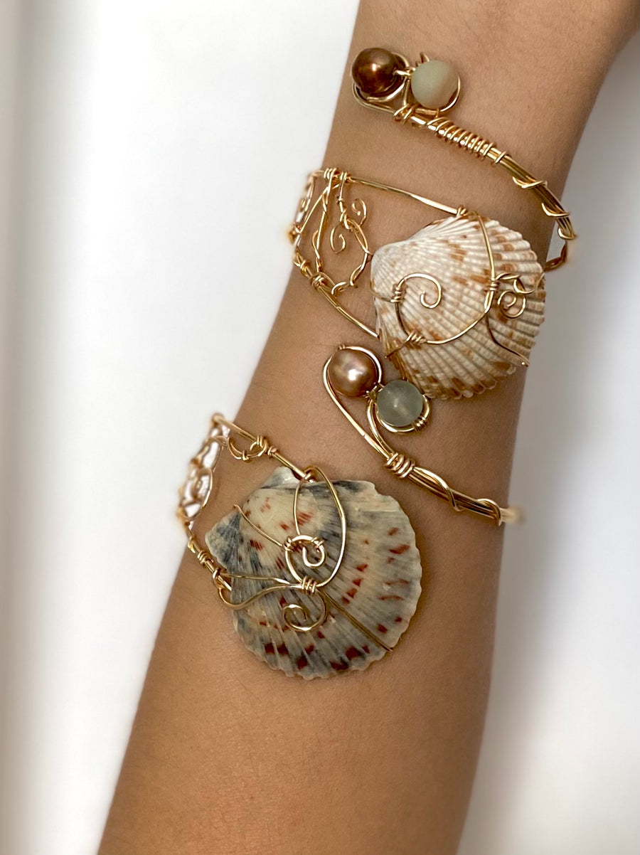 Example of a handmade Mermaid Tail shell and pearl cuff